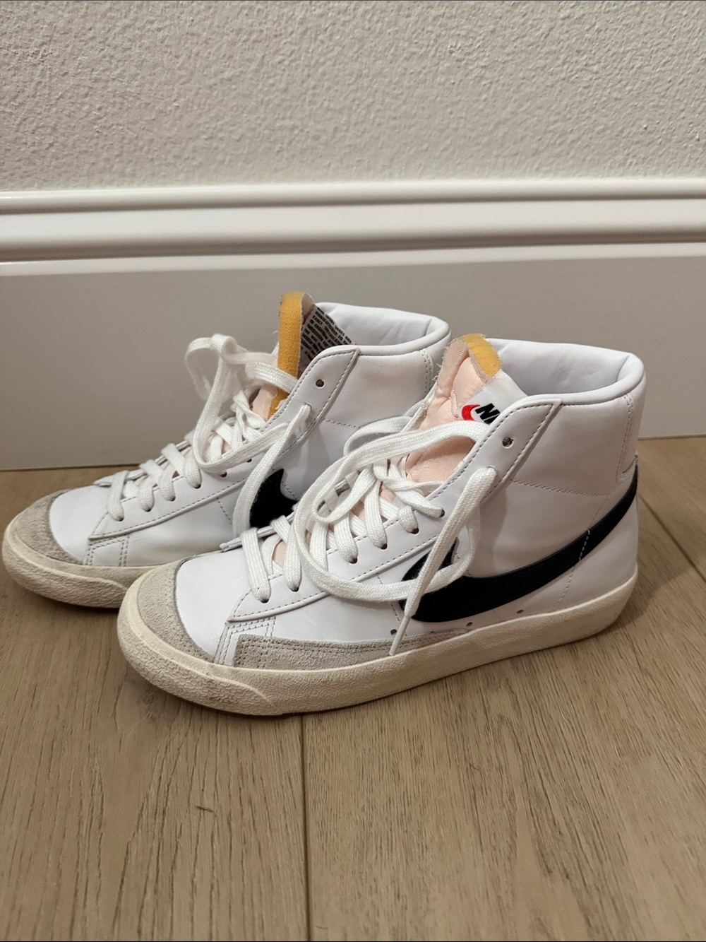 Nike Women’s White High-Top Sneakers with Black Swoosh and Yellow Tongue